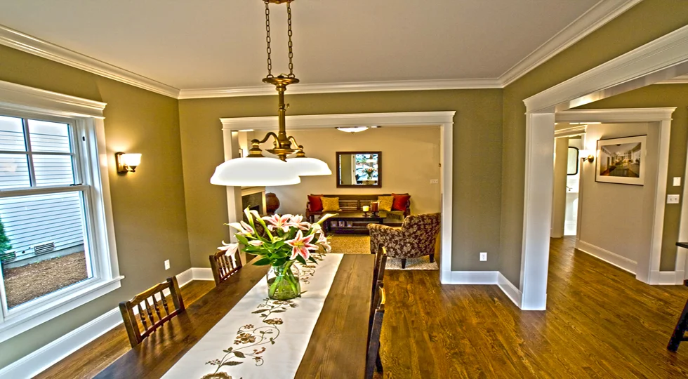 Dining room with painted walls and detailed white architectural trim
